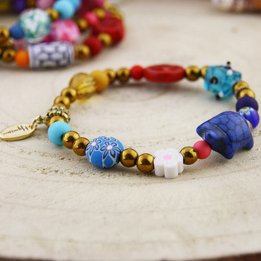 Fantasie armband in goud en blauw tinten - HanneHaves