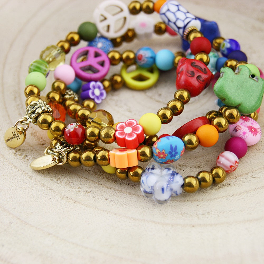 Fantasie armband in goud en blauw tinten